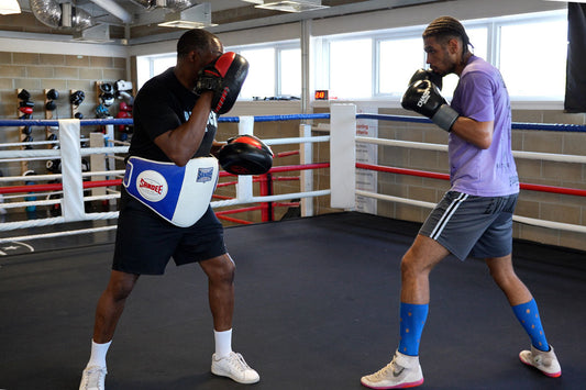 Professional boxer Paul Gordon in the ring with his coach 